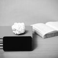 Stack of book with smart phone black and white color tone style Royalty Free Stock Photo