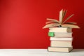 Stack of books against red background Royalty Free Stock Photo
