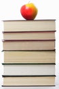 Stack of books with apple on top Royalty Free Stock Photo