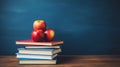 Stack of books with apples on top Royalty Free Stock Photo