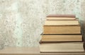 Stack of books on the wooden table. Education background.Back to school. Copy space for text.