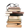Stack of Books with Black Eyeglasses on Top Isolated on White Background pile reading Royalty Free Stock Photo