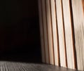 Stack of books on black table and light from sun Royalty Free Stock Photo