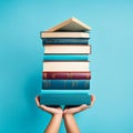 Stack of books on blue background. Education concept. AI generated Royalty Free Stock Photo