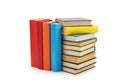 A stack of books with a blue book in the middle AI Generated Royalty Free Stock Photo
