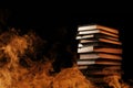 Stack of books in a burning fire