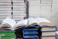 stack of books, close up. Open book on the table in library. Back to school concept. Royalty Free Stock Photo