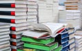 stack of books, close up. Open book on the table in library. Back to school concept Royalty Free Stock Photo