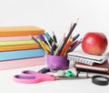 Stack of books and colorful school supplies on white background.photo with copy space Royalty Free Stock Photo