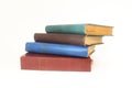 Stack of books in colour covers with white sheets isolated on a white background Royalty Free Stock Photo