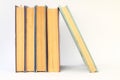 Stack of books in colour covers with white sheets isolated on a white background Royalty Free Stock Photo