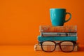 A Stack of Books, Cup of Coffee, and Reading Glasses Royalty Free Stock Photo