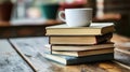a stack of books with a cup of coffee on top Royalty Free Stock Photo
