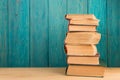 stack of books on the desk over wooden background Royalty Free Stock Photo