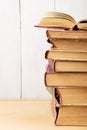 stack of books on the desk over wooden background Royalty Free Stock Photo