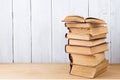 stack of books on the desk over wooden background Royalty Free Stock Photo