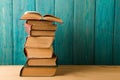 stack of books on the desk over wooden background Royalty Free Stock Photo