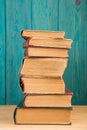 stack of books on the desk over wooden background Royalty Free Stock Photo