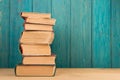 stack of books on the desk over wooden background Royalty Free Stock Photo