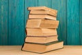 stack of books on the desk over wooden background Royalty Free Stock Photo