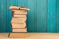 stack of books on the desk over wooden background Royalty Free Stock Photo