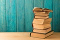 stack of books on the desk over wooden background Royalty Free Stock Photo