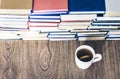 Stack of books education background, many books piles and cup of tea with lemon Royalty Free Stock Photo