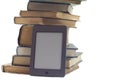 STACK OF BOOKS AND ELECTRONIC BOOK READER. Royalty Free Stock Photo