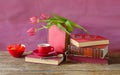 stack of books, espresso coffee and tulips, reading and education in the springtime Royalty Free Stock Photo