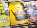Stack of books featuring gaea schoeters trophÃÂ¤e with rhinoceros cover Royalty Free Stock Photo