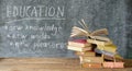 Stack of books in front of a blackboard.Back to school, reading, education,library concept