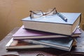 Stack Of Books With Glasses And Pen At Top Royalty Free Stock Photo