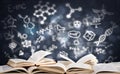 Stack of books with gloving education symbols Royalty Free Stock Photo