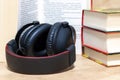 stack of books .headphones.