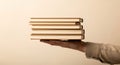 Stack of books held in human hand, concept of learning, education, and literature Royalty Free Stock Photo