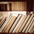 Stack of books on library bookshelf - Square composition Royalty Free Stock Photo