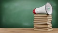Stack of Books with Megaphone on Top Royalty Free Stock Photo