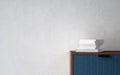 Stack of books on modern nightstand