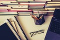 Stack of books, notebook, laptop, glasses in office background for education learning concept top view Royalty Free Stock Photo