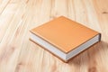 Stack of books and notebooks with a pencil holder on a wooden desk, showcasing calm and organized study or work Royalty Free Stock Photo