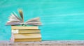 Stack of books, one open, Royalty Free Stock Photo