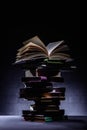 stack of books with open book on top Royalty Free Stock Photo