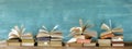 Stack of books with open books in a row. Reading,literature,education,library,home office concept, panoramic, copy space Royalty Free Stock Photo