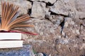 Stack of books and Open hardback book on blurred Royalty Free Stock Photo