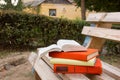 Stack of books and Open hardback book on blurred nature landscape backdrop. Copy space, back to school. Education Royalty Free Stock Photo