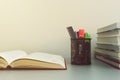 Stack of books, opened book and school tools on the table. Back Royalty Free Stock Photo