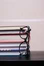 Stack of books with a pair of glasses Royalty Free Stock Photo