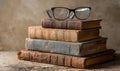 A stack of books with a pair of glasses on top Royalty Free Stock Photo