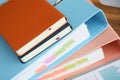 Stack of books with paper foder lie in office against Royalty Free Stock Photo