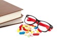 Stack of books and pills, capsules. Medicaments. Royalty Free Stock Photo